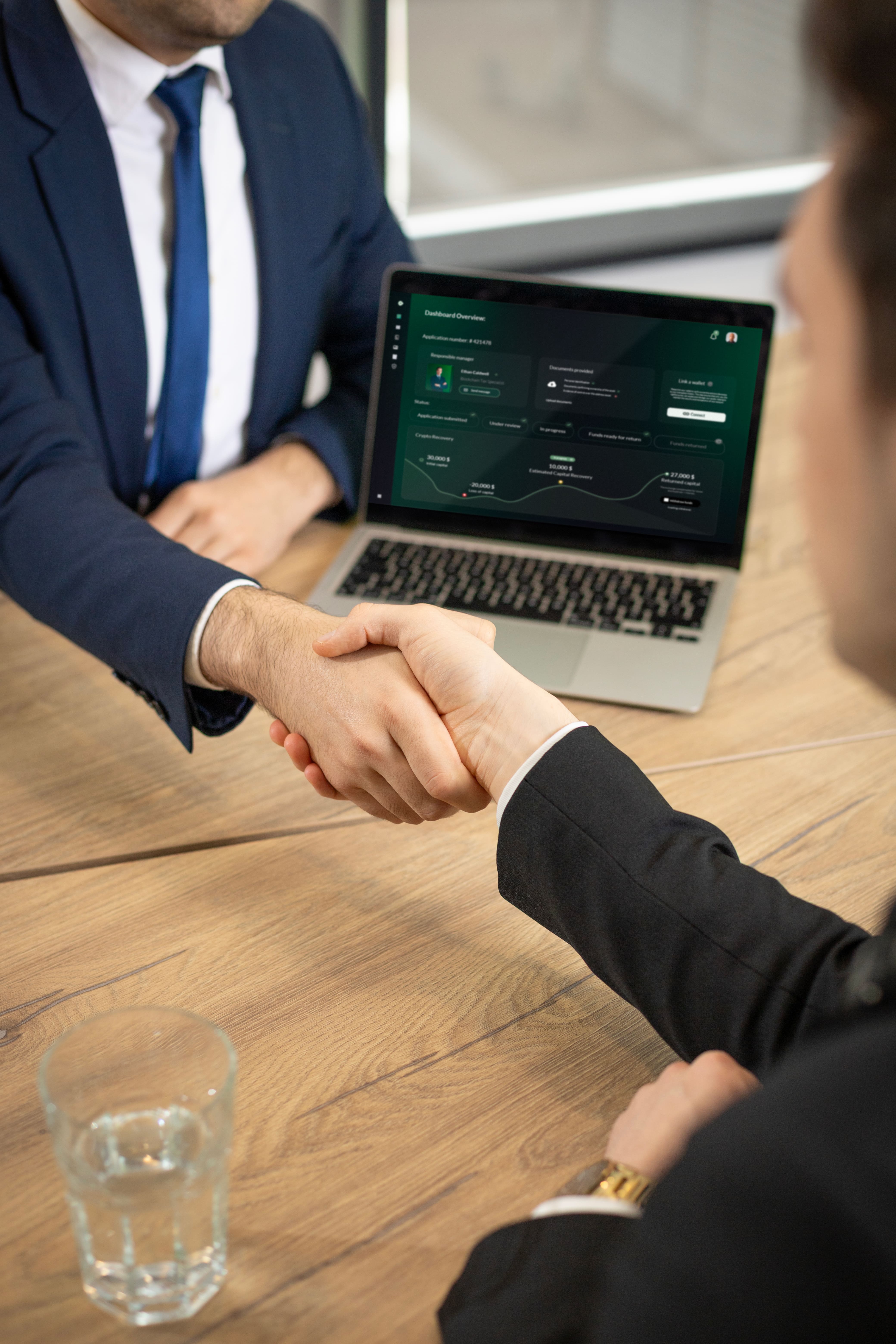 Two people are shaking hands